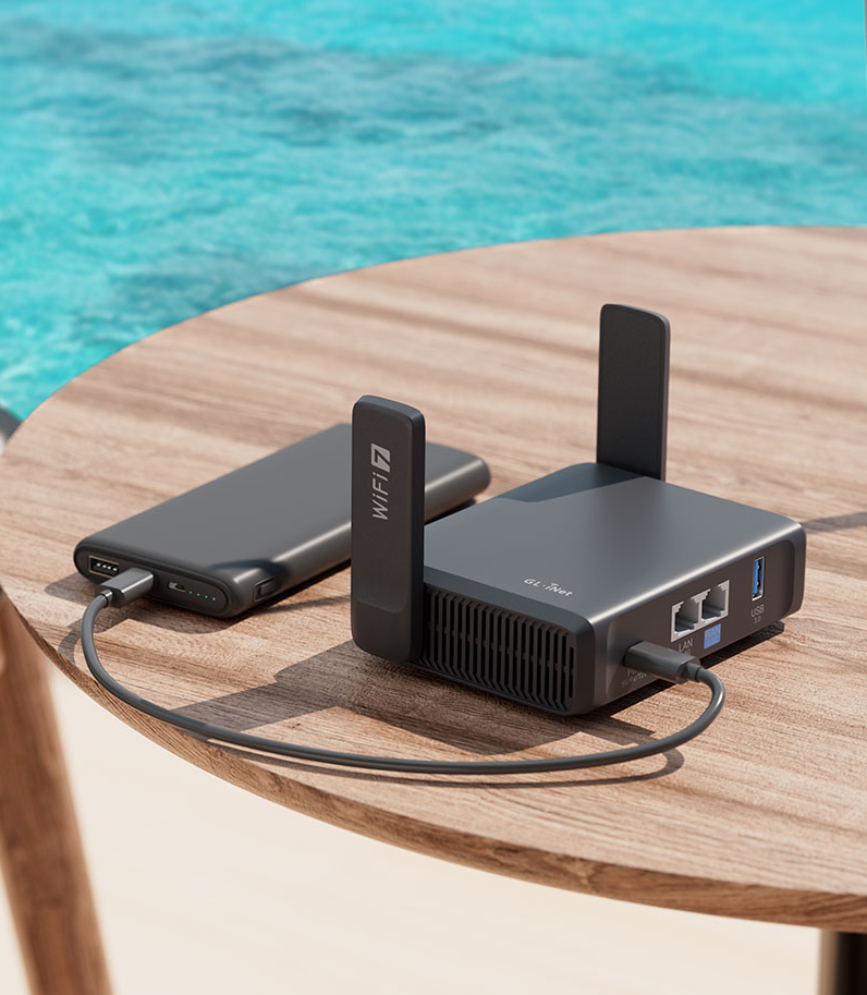GL.iNet Slate 7 (GL-BE3600) 13 Slate 7 router on desk behind pool with powerbank
