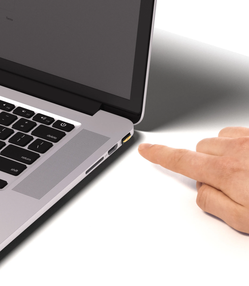 Yubikey 5 Nano in laptop with human finger