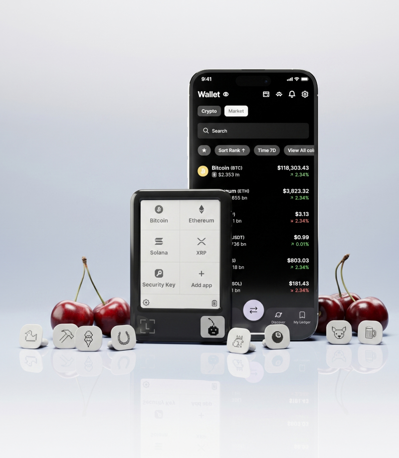 Ledger Nano Gen5 Badges on desk with Ledger Nano Gen5 and phone