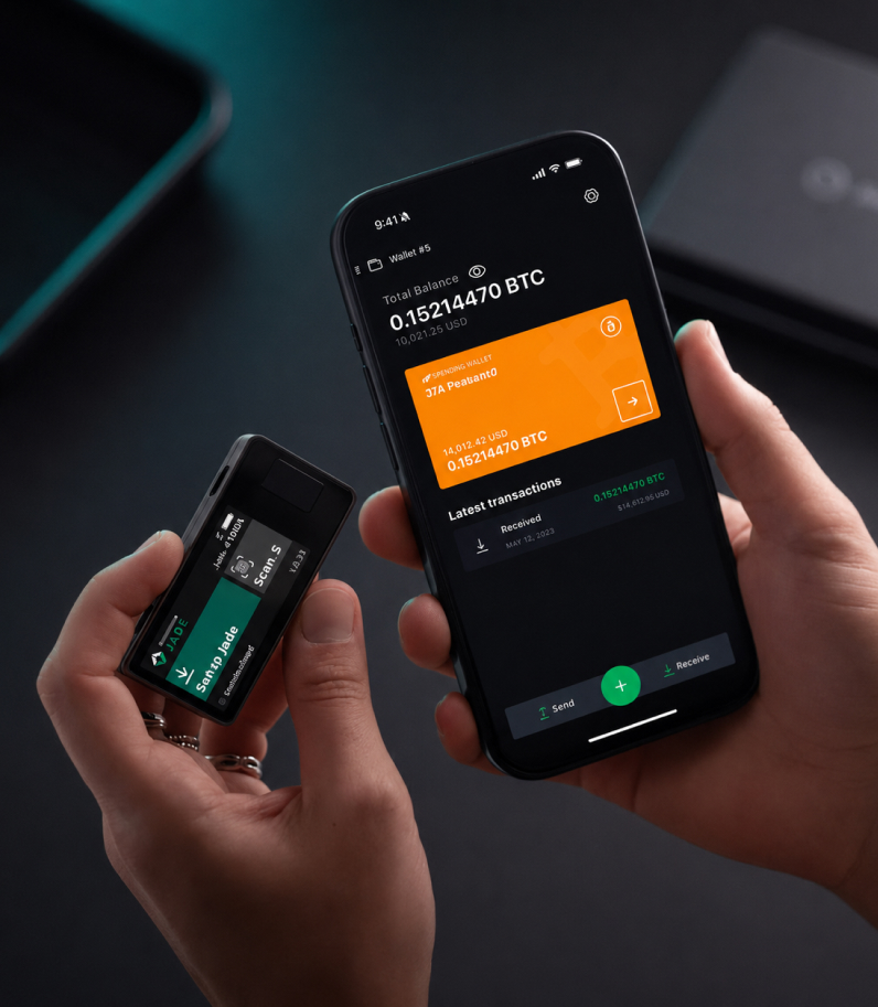 Blockstream Jade Plus 7 Blockstream Jade Plus Behind Phone In Hands