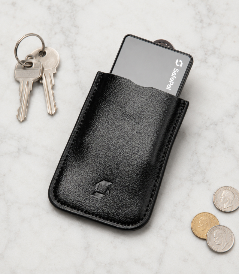 Safepal S1 Case On Desk With Safepal S1 Wallet Behind Case And Coins